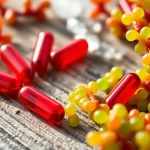 Highlighting the strongest antioxidant in nature, vibrant Astaxanthin capsules set amidst green algae.